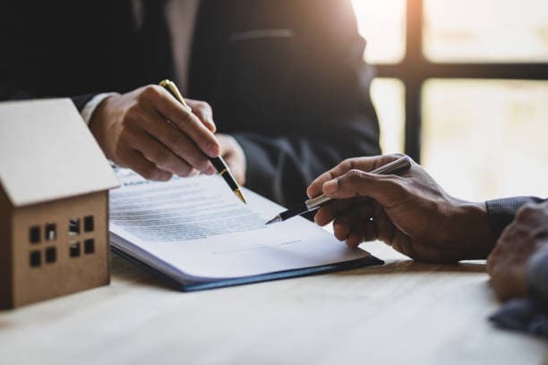 Attorney reviewing estate planning documents with clients
